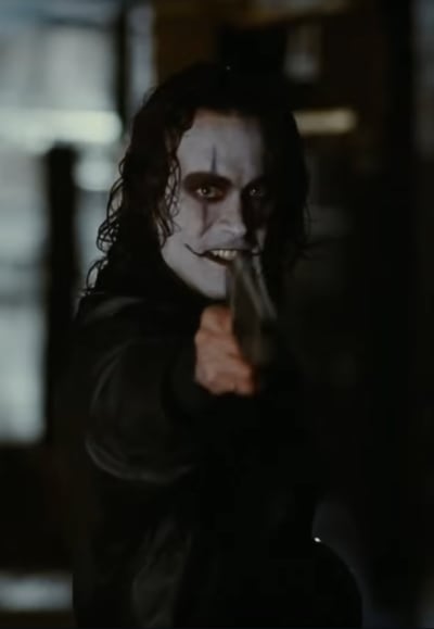 eric draven stares down the barrel of a gun